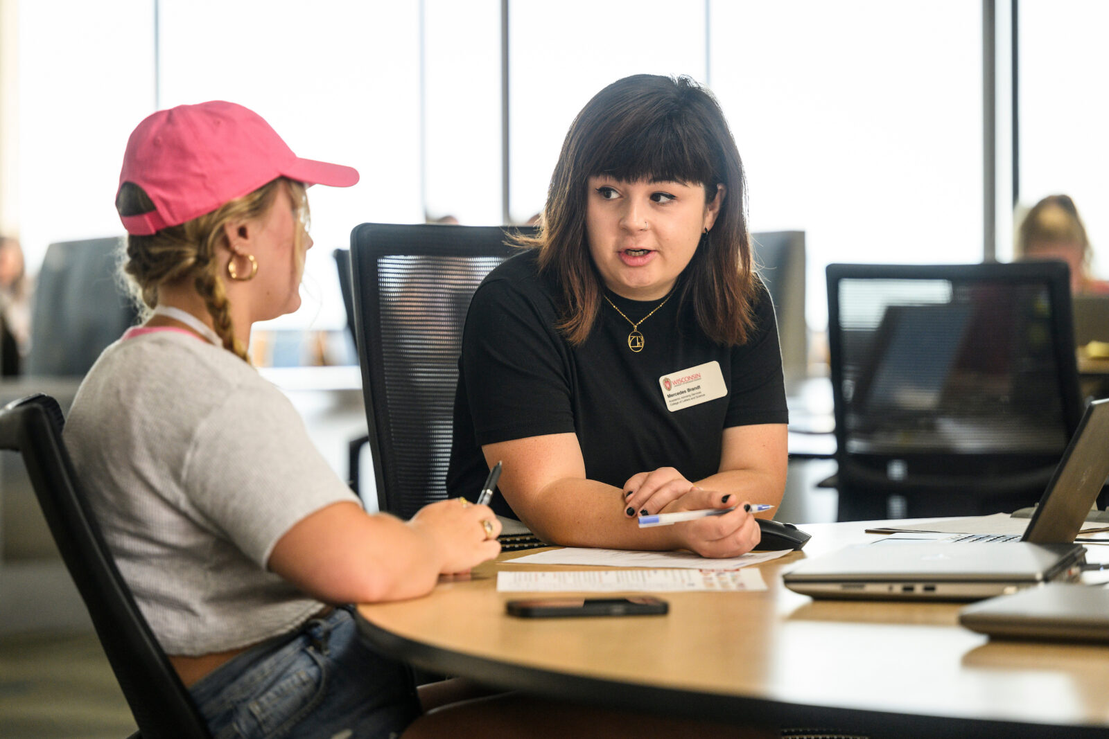 An advisor assisting a student